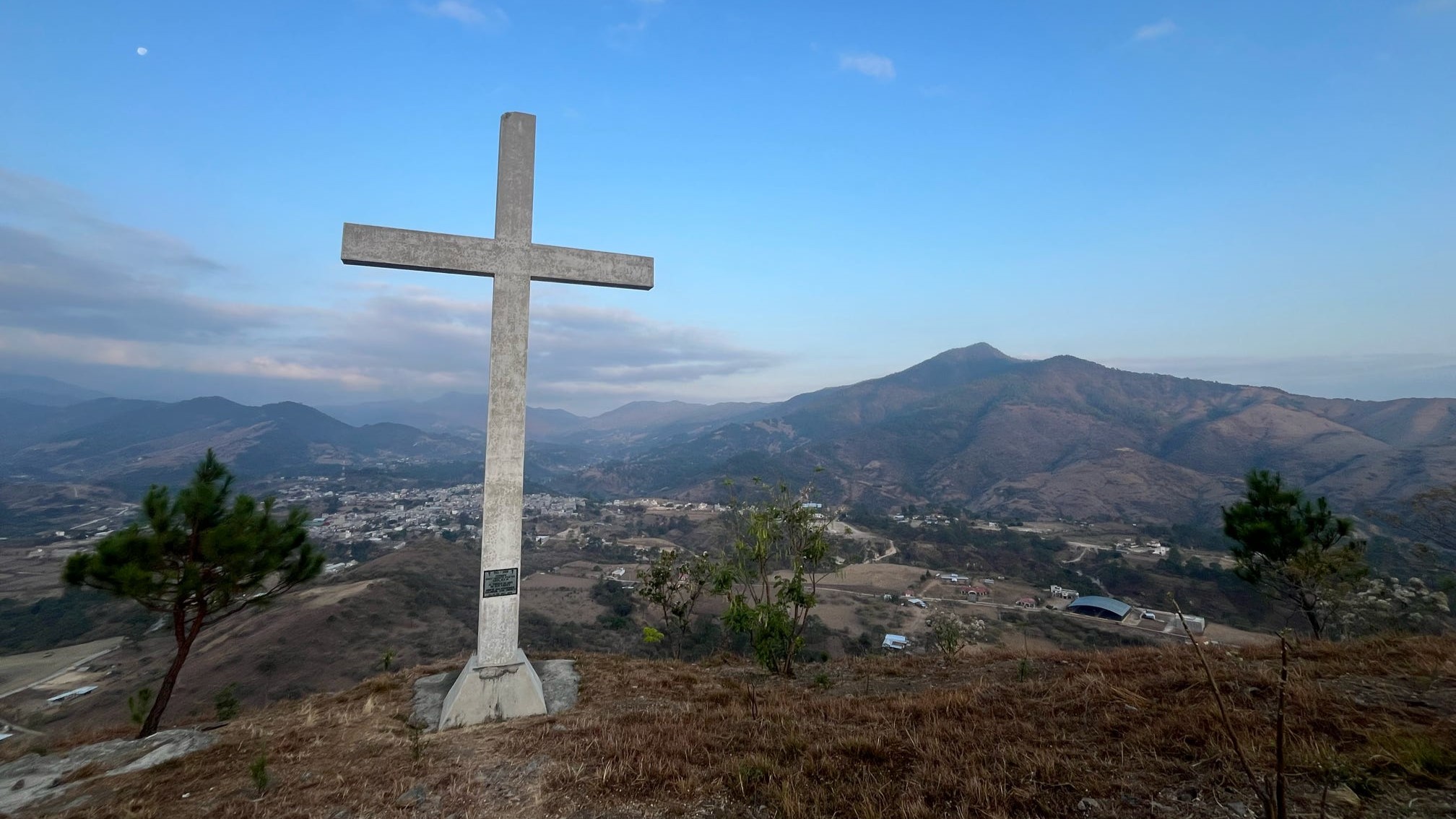 Cross overlooking the valley in the mountains